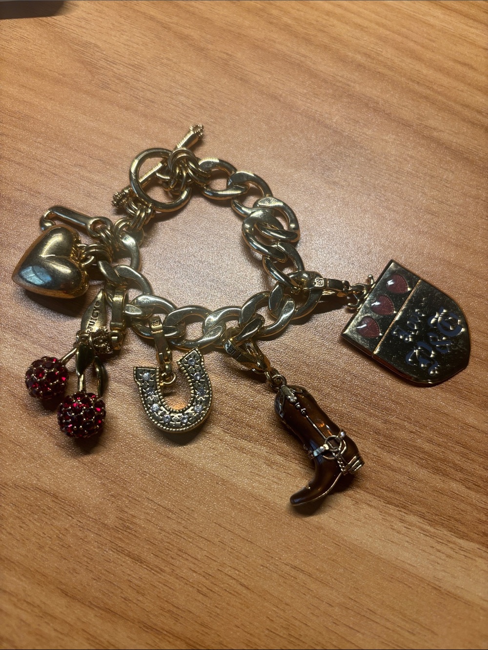 Juicy Couture Gold Charm Bracelet with Heart, Horseshoe & Cherry Charms - Gold